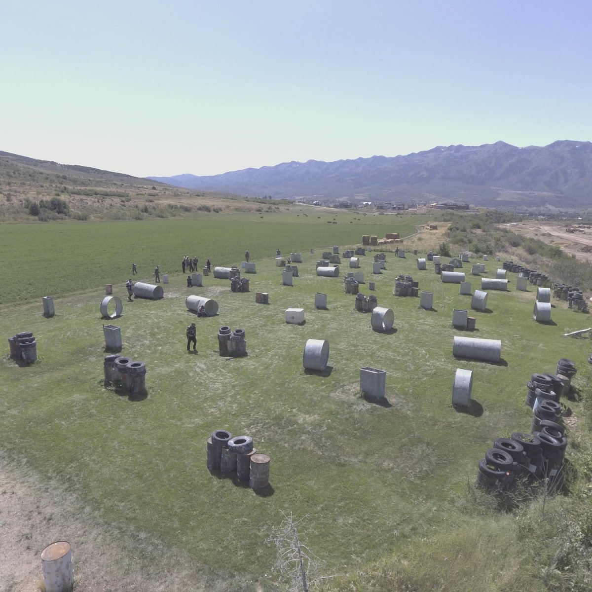 Aerial view of the Castle Hyperball Field at Action Center Paintball in Utah showing the castle structure, hyperball obstacles, and outdoor paintball battlefield.