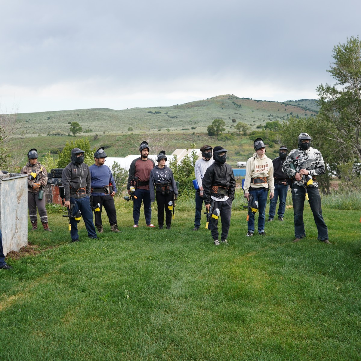 Corporate team building paintball event at Action Center Paintball in Utah where coworkers compete in outdoor paintball games during a company party.